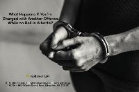 Charged with a New Offence While on Bail in Alberta: Legal Consequences and Actions